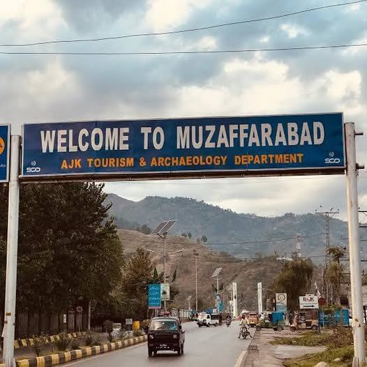 May be an image of road and text that says 'SCO WELCOME TO MUZAFFARABAD AJK TOURISM & ARCHAEOLOGY DEPARTMENT SCO BaJK'