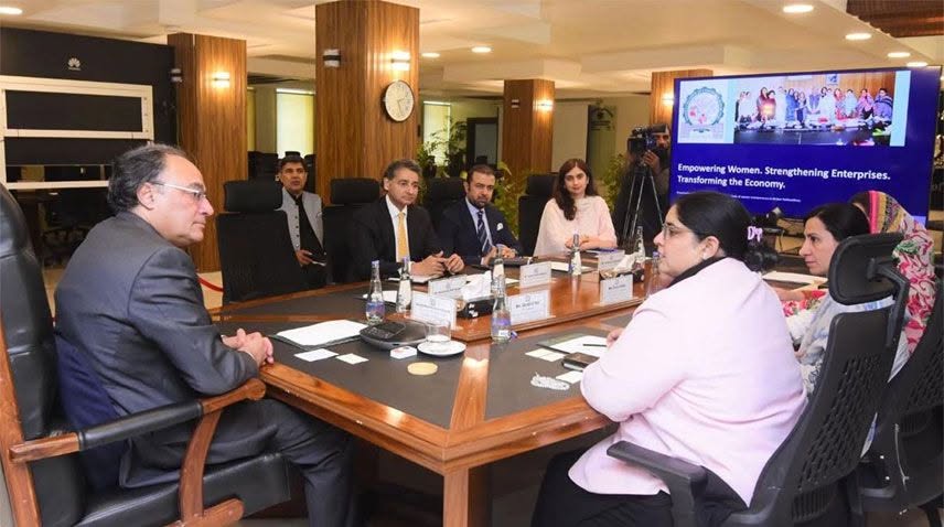 May be an image of table, newsroom and text