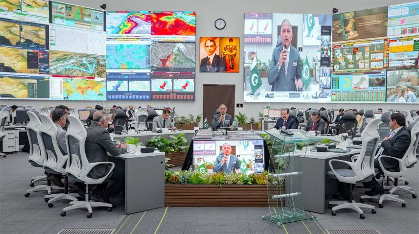 May be an image of television, newsroom and text