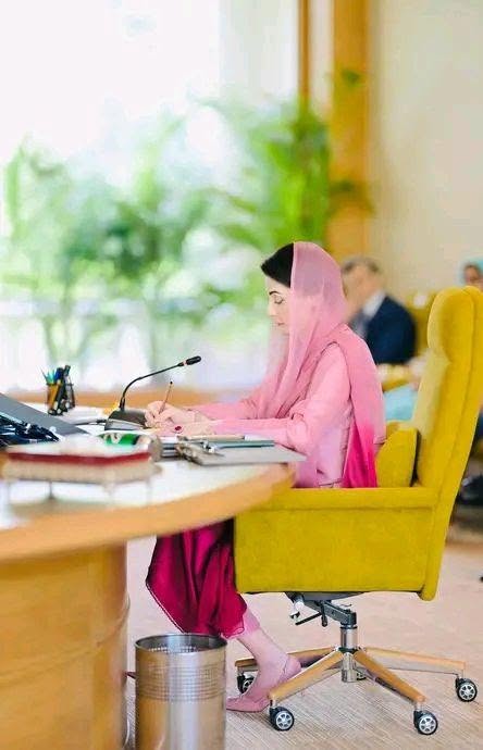 May be an image of studying and headscarf